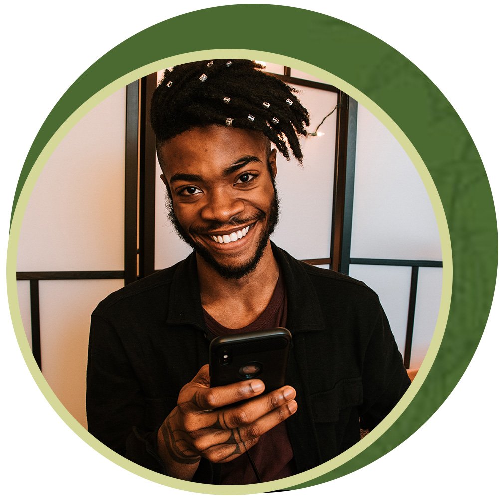 Man smiling on his device